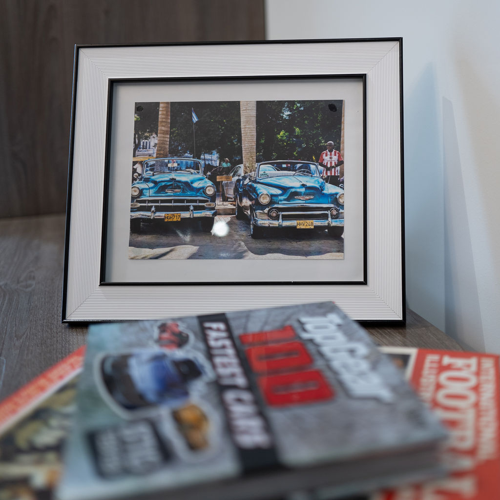 A framed photo of cars 