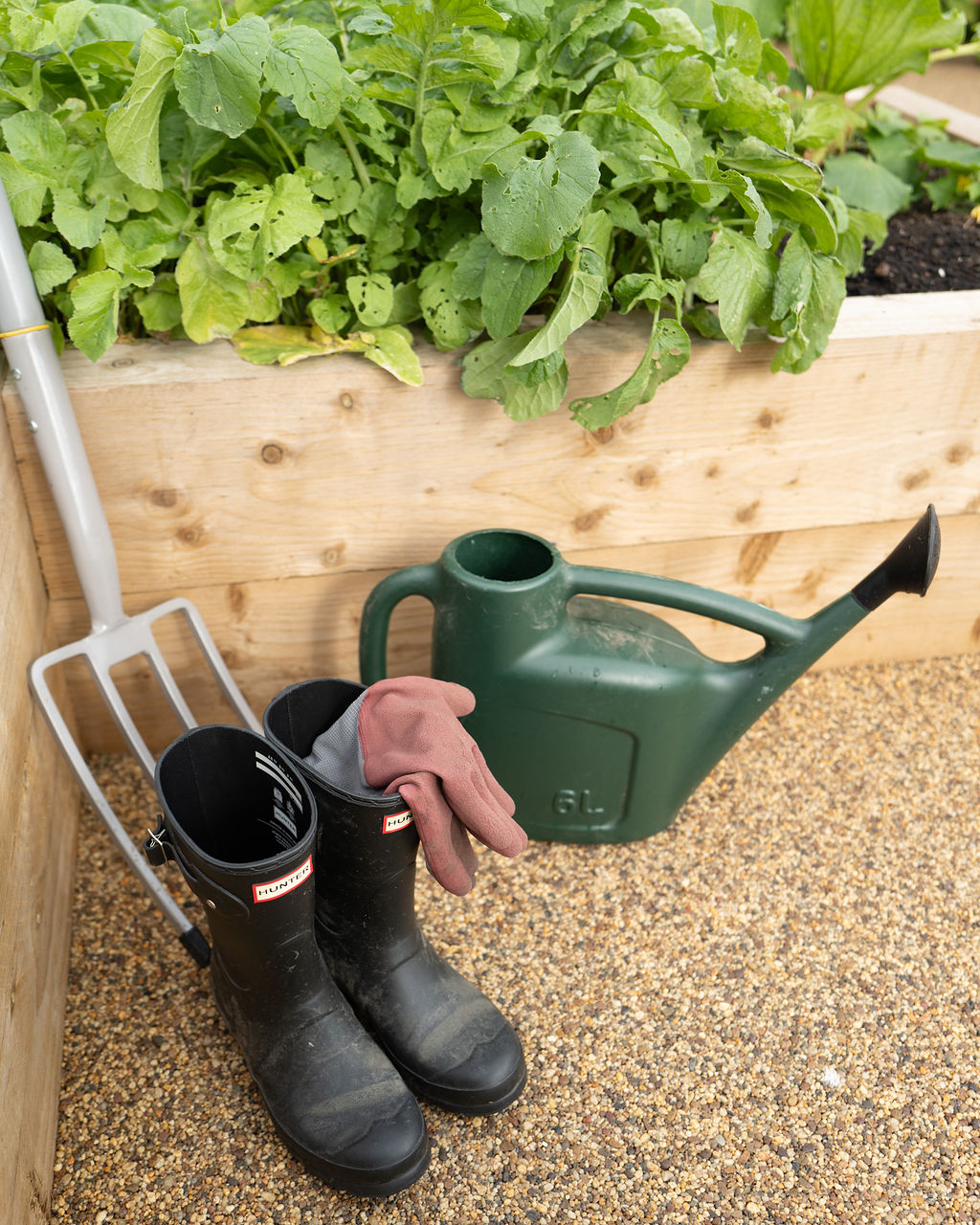 Gardening tools and wellington boots