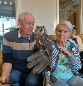 residents with the owls that came into visit