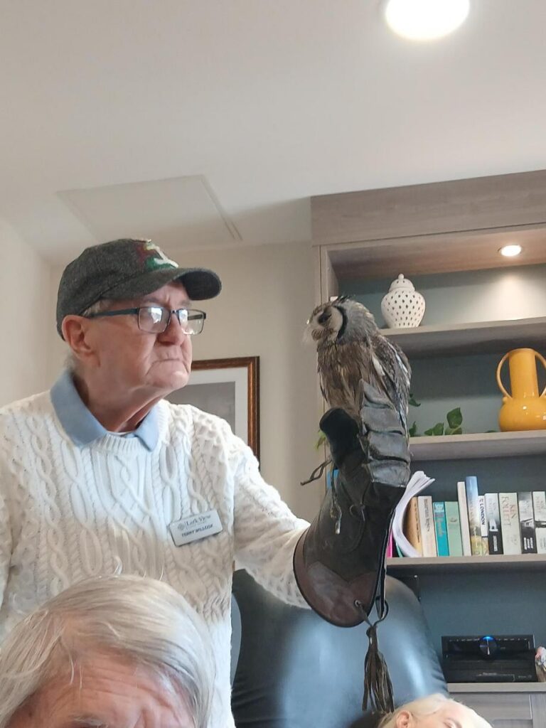 terry with an owl at the care home